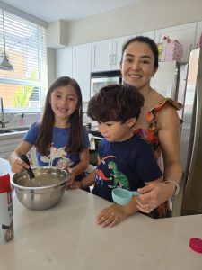 mom cooking together with her two children