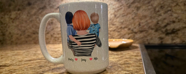Image: A mug with a customized image of a mother holding her 2 children