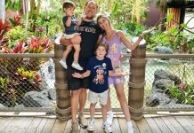 Image: A family poses for a photo at Disney