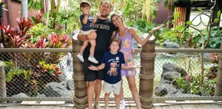 Image: A family poses for a photo at Disney