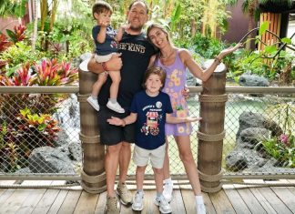 Image: A family poses for a photo at Disney