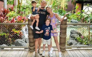 Image: A family poses for a photo at Disney