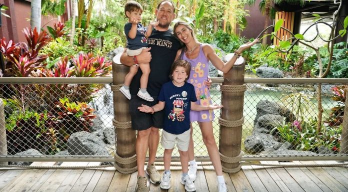 Image: A family poses for a photo at Disney