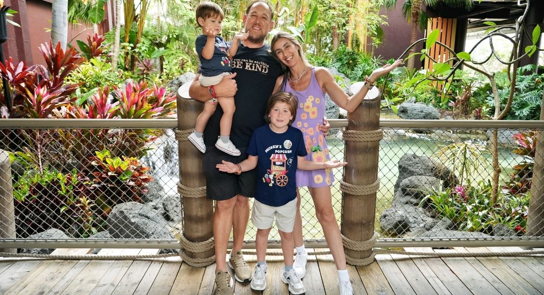 Image: A family poses for a photo at Disney