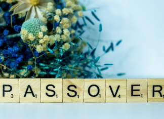 Passover Breakfast: 2 Kid-Approved Recipes for the Week Image: A bouquet of blue dried flowers behind Scrabble tiles spelling out PASSOVER