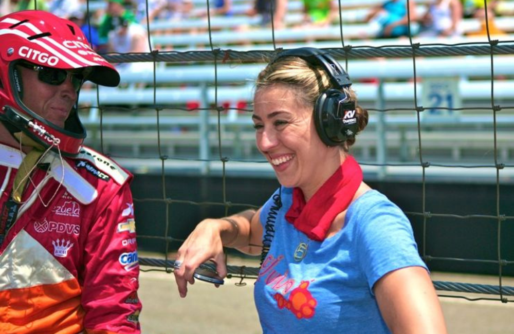 Image: Sandra (right) with an Indy driver at the 2012 Indy500 Race
