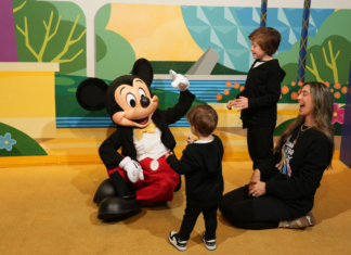 Image: Mom of two with her boys and Mickey Mouse at Walt Disney World