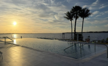 voco Sandpiper Bay: A Family-Friendly All-Inclusive Resort Image: A sunset view of the infinity pool at voco Sandpiper Bay All-Inclusive Resort