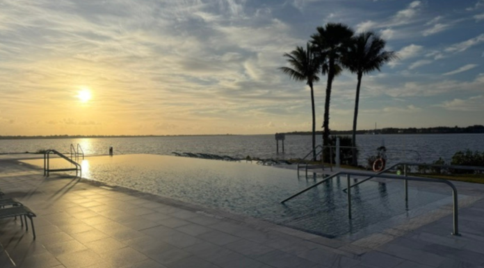 Image: A sunset view of the infinity pool at voco Sandpiper Bay All-Inclusive Resort