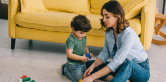 Image: A mother and son playing with Legos