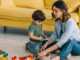 Image: A mother and son playing with Legos