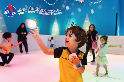 Image: A child enjoys the Winter Wonderland experience at Miami Children's Museum