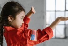 Image: A little girl demonstrates a taekwondo pose