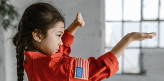 Image: A little girl demonstrates a taekwondo pose