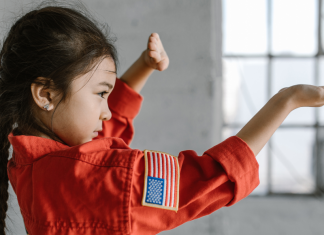 Martial Arts: Keep Your Family Fit & Connected Image: A little girl demonstrates a taekwondo pose