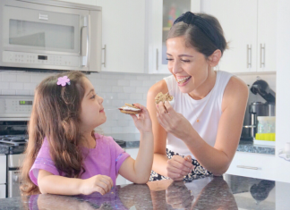6 Summer Treats to Make With Your Kids Before Back-to-School Image: A mother and daughter enjoy some homemade summer-themed treats