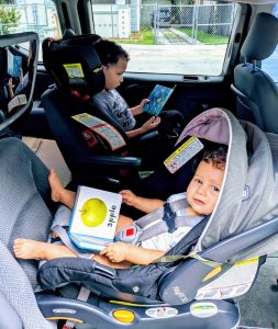 Image: Two little kids holding library books