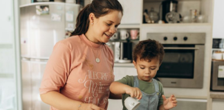 Family Traditions: 5 Small Rituals That Will Make a Big Impact Image: Mom and child share the family tradition of cooking together