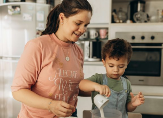 Family Traditions: 5 Small Rituals That Will Make a Big Impact Image: Mom and child share the family tradition of cooking together