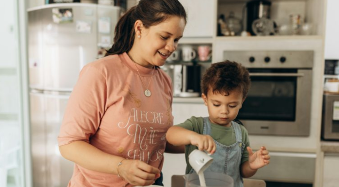 Image: Mom and child share the family tradition of cooking together
