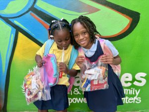 Image: Two children with holiday snack packs
