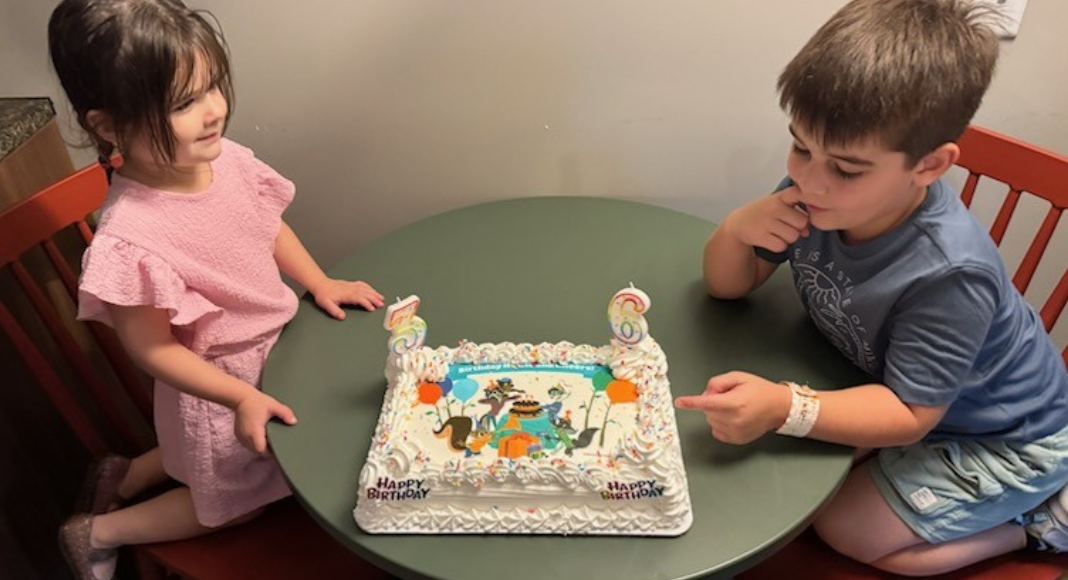 Image: Kids sneaking a bite of the birthday cake