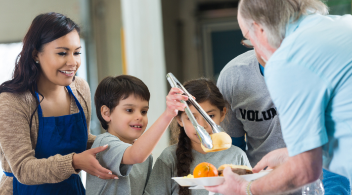 Image: A family serves a meal together