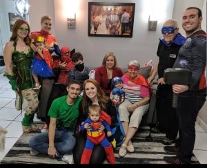 Image: A family dressed up as superheroes and villians