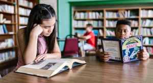 Image: Children read books at a local library