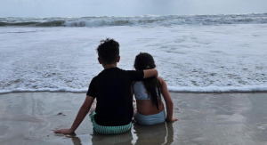 Image: Kids sitting on the beach