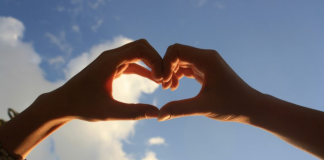 Image: Two hearts form a heart against a blue sky