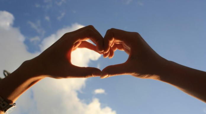 Image: Two hearts form a heart against a blue sky