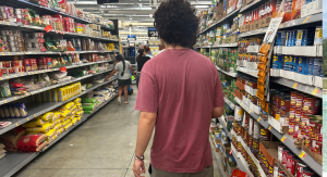 Image: A college student shops at a grocery store