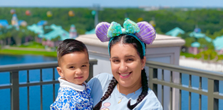 Topolino’s Terrace: Flavors of the Riviera | Disney Dining Series Image: Daniella and her son pose for a photo on the terrace at Topolino's