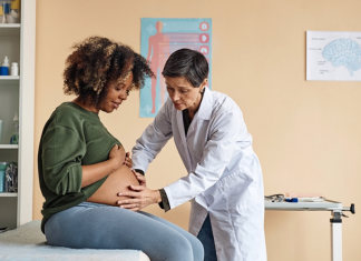 Image: An ob/gyn provides care to an expectant mother