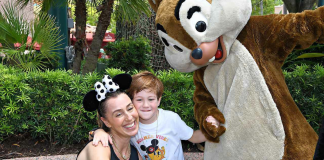 Summer Theme Park Survival Basics: 12 Helpful Tips for Your Trip Image: A mother and son pose for a photo with Chip and Dale