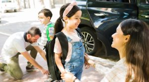 Image: Parents help their kids get ready for school