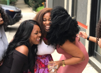 Image: A group of women laughing together