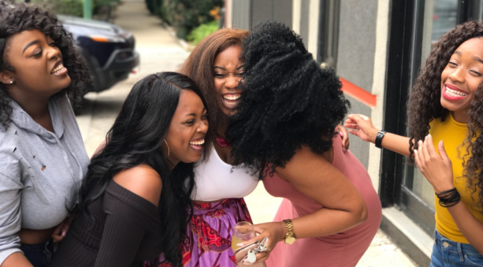 Image: A group of women laughing together