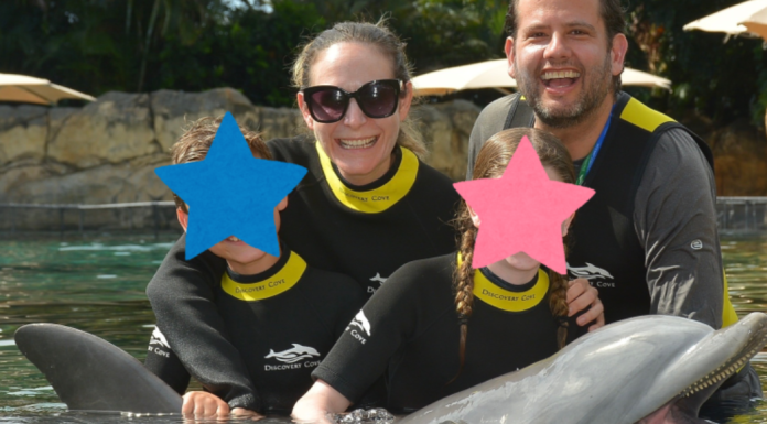 Discovery Cove: A Day of Discovery in Orlando Image: Ilana's family enjoys a swim with a dolphin at Discovery Cove Orlando