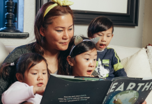 Slowing Down as a Parent: The Importance of Seizing the Moments Image: A woman reads a book with her children