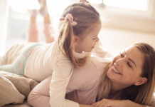 Self-Compassion: A Guide for Working Parents Image: A mom and daughter having fun together