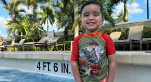 Image: Daniella's son poses for a photo in a swimming pool