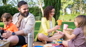Image: A family enjoys an outdoor picnic at the park