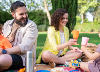 Image: A family enjoys an outdoor picnic at the park