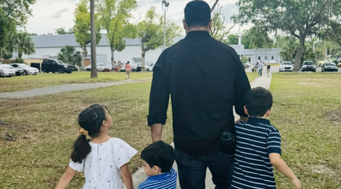 Dad Hacks: 5 Things We Can Learn From Dads Image: A dad walking with his 3 children