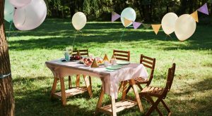 Image: A table set for an outdoor birthday party