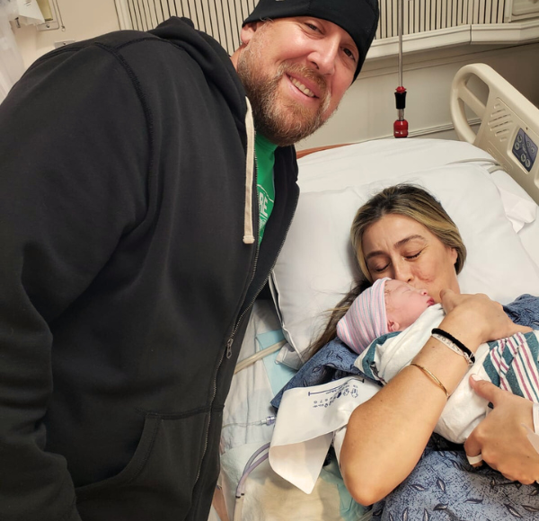 Image: Sandra and her husband with their newborn son