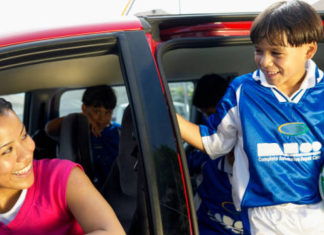 Image: A mom drops her son off at sports practice