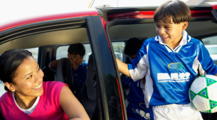 Image: A mom drops her son off at sports practice